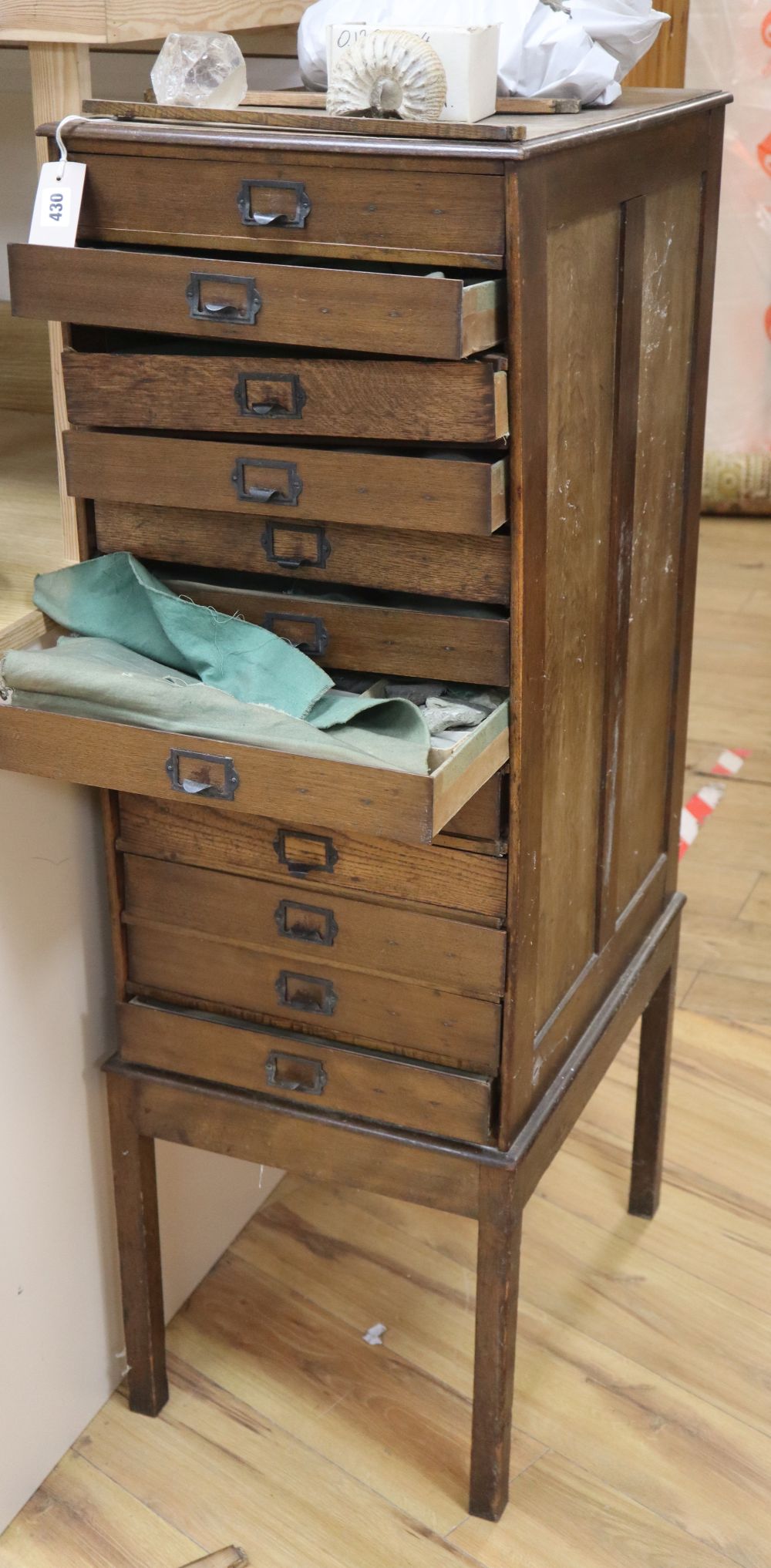 A chest of fossil and shell specimens